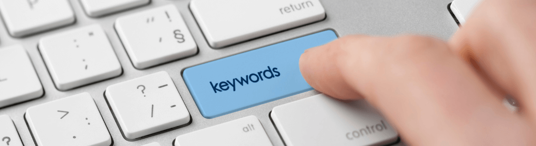 keyboard with blue key spelling keywords