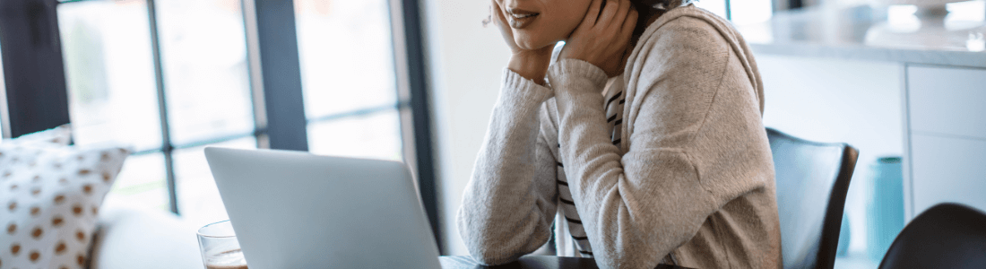 woman in front of laptop using resume checker